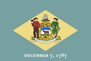 Adopted on July 24, 1913, the Delaware state flag has a background of colonial blue surrounding a diamond of buff color in which the coat of arms of the state is placed. Below the diamond are the words “December 7, 1787,” indicating the day on which Delaware was the first state to ratify the United States constitution. Because of this action, Delaware became the first state in the Union, and is, therefore, accorded the first position in such national events as presidential inaugurations. According to members of the original commission established to design the flag, the shades of buff and colonial blue represent those of the uniform of General George Washington. Inside the diamond, the flag recognizes the importance of commerce {the ship} and agriculture {wheat, corn, the ox and the farmer} to the state. Tribute is also paid to the revolutionary war soldiers. The words in the ribbon banner read Liberty and Independence.